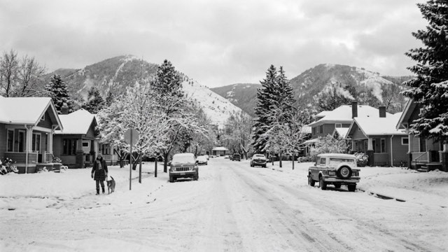 Snow on residential rooftops in Huson, MT